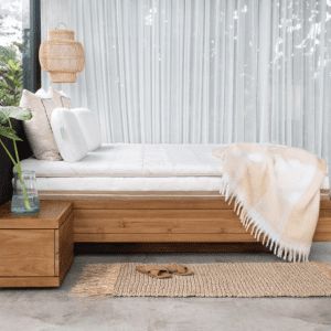 Heveya III natural latex mattress displayed in a modern bed frame, showcasing its plush, organic design.