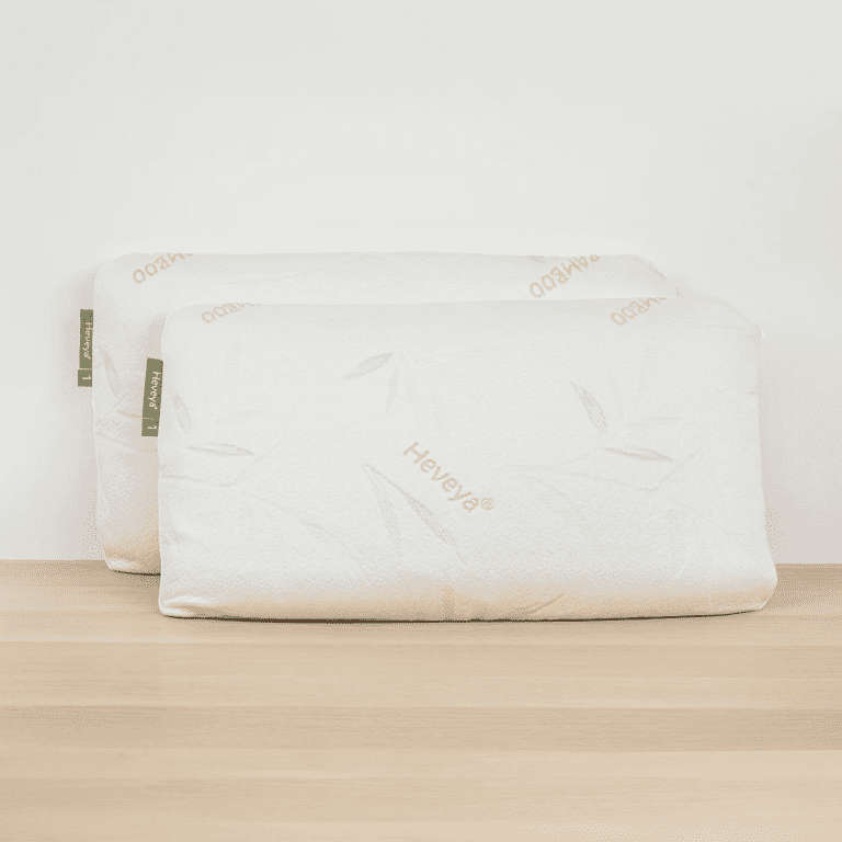 Close-up view of a soft, thin Heveya organic latex pillow against a white background. Perfect for breathable and pressure-relieving sleep. This pillow is ideal for stomach and back sleepers.