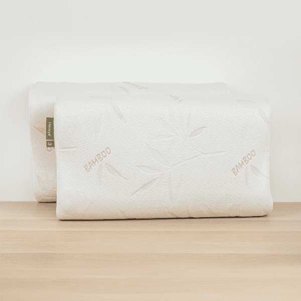 2 Close-up view of the Heveya Contoured Organic Latex Pillow. This breathable, eco-friendly pillow features a contoured design for optimal spinal alignment.