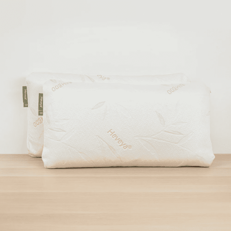 Close-up view of the Heveya Firm Pillow for Side Sleepers. This breathable, 100% natural latex pillow provides firm support and pressure relief for side sleepers.