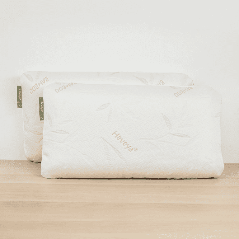 Close-up view of the Heveya Pillow 2, a soft and plush organic latex pillow against a white background. Designed for side and back sleepers.