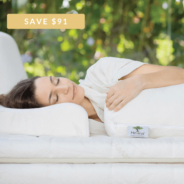 1 Woman experiencing a comfortable night's sleep with the Heveya® Organic & Natural Latex Pillow Set. This customizable bundle allows you to choose your ideal firmness and shape for personalized comfort and support.